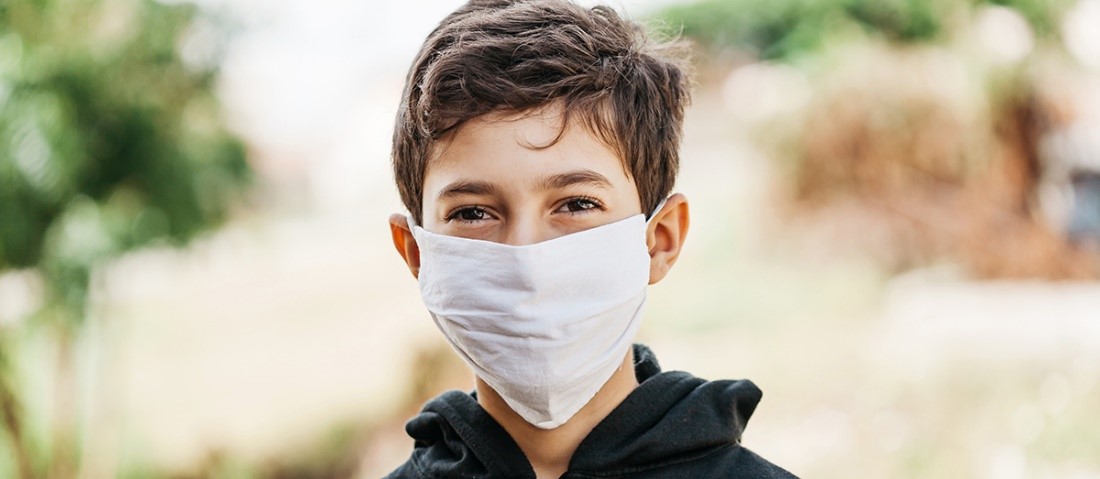 Child in yellow mask